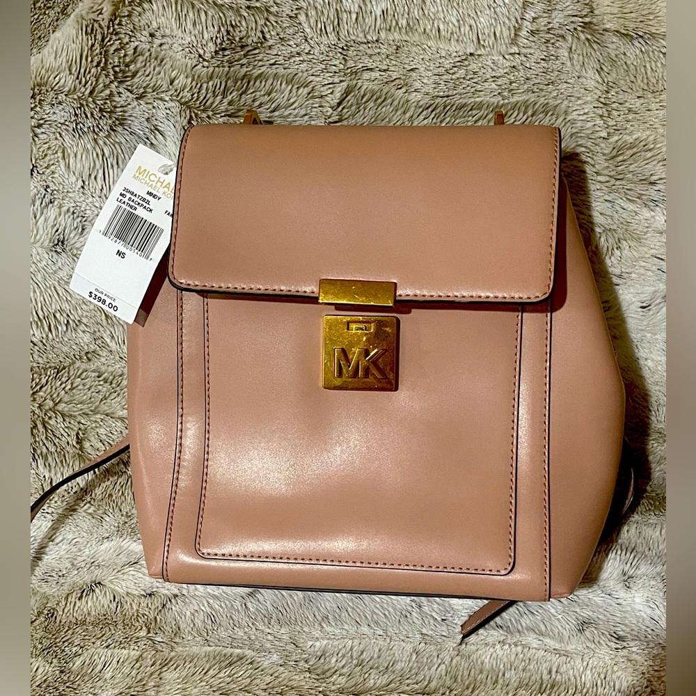 Brand new Micheal Kors Mindy Leather bag pack. With Tag. Pink color.